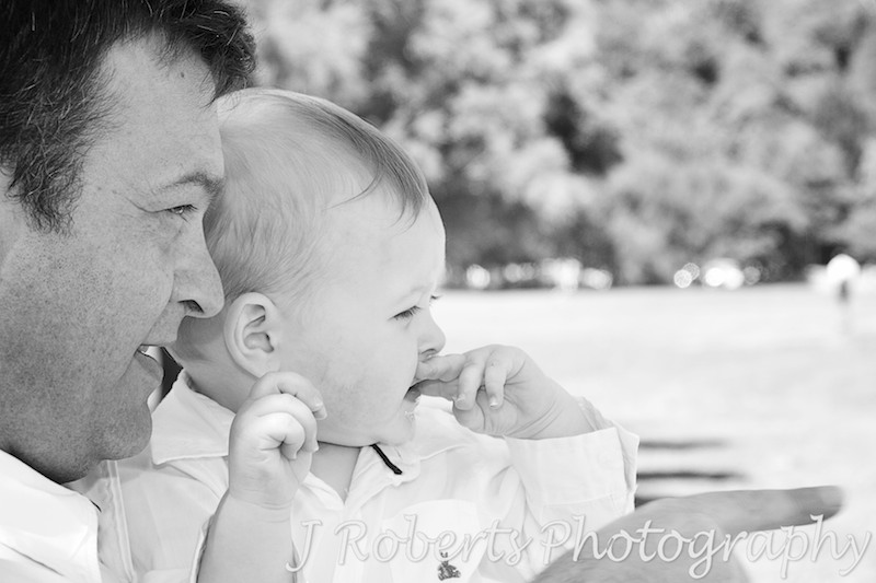 Boy and father looking out to sea - family portrait photography sydney